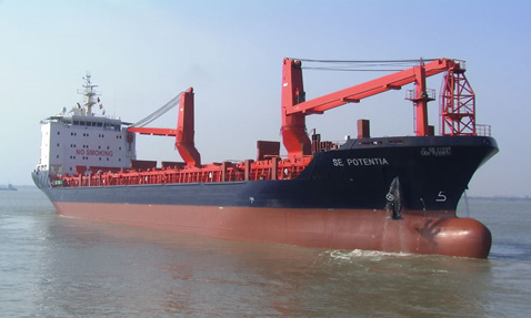 Cargo ship "SE POTENTIA" sailing in calm waters, featuring red cranes.