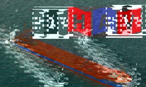 Cargo ship sailing in open sea with HAV logo above.