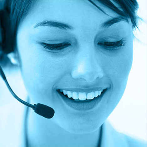 Smiling woman wearing a headset, providing customer service support.