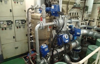 Industrial machinery and control panels in a fluid handling facility.