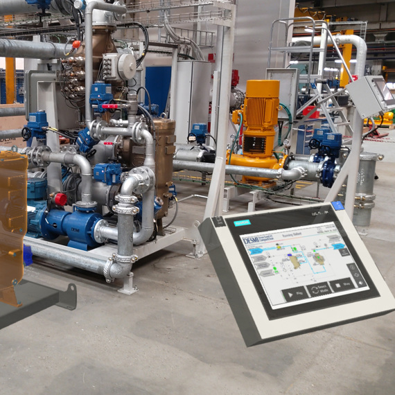 Industrial setup with DESMI pumps and control panel for fluid handling operations.